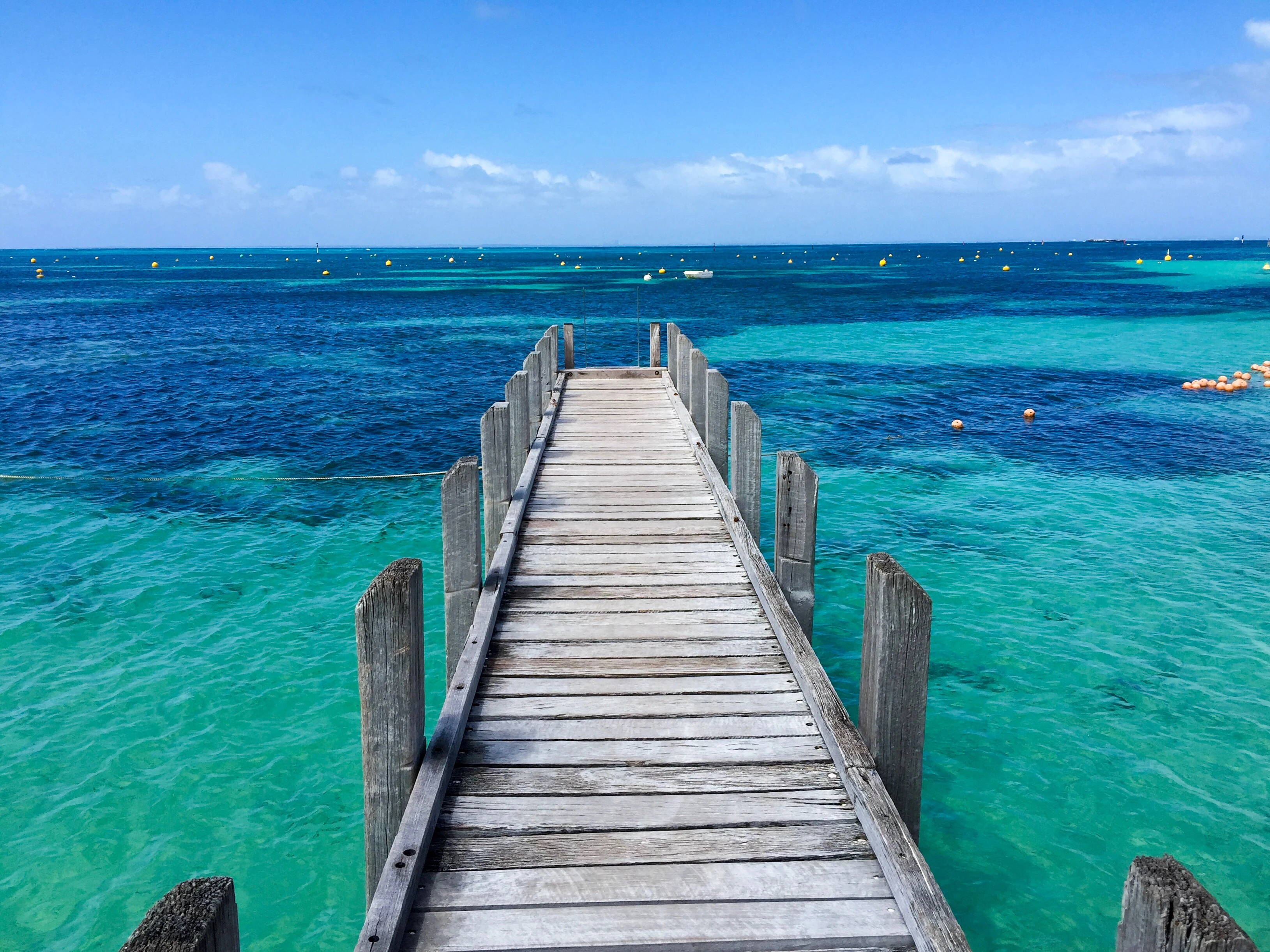 pier-calm-blue-sea-against-sky